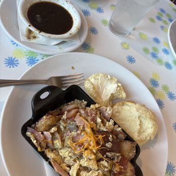 Big Bad Breakfast signature dishes "The Pylon" (Hot-off-the-griddle pancakes), Shrimp and Grits, Cathead Chicken Biscuit, Big Bad Breakfast Plate